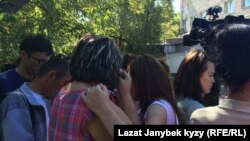 People gather outside the site of the fire in northeast Moscow.