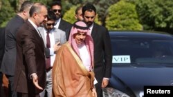 Iranian Foreign Minister Hossein Amir-Abdollahian (left) greets Saudi Arabia's Foreign Minister Prince Faisal bin Farhan Al Saud in Tehran on June 17.