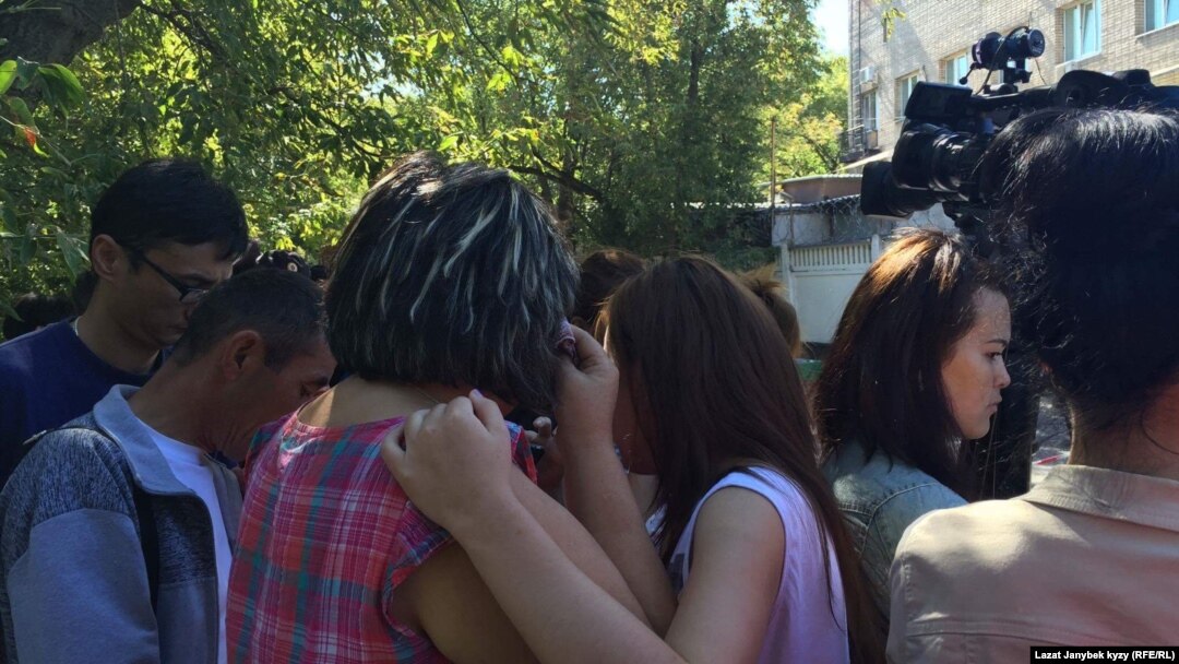 People gather outside the site of the fire in northeast Moscow.