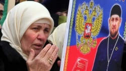 Chechnya -- A Chechen woman holds a picture of Chechen leader Ramzan Kadyrov during a rally in central Grozny, January 22, 2016