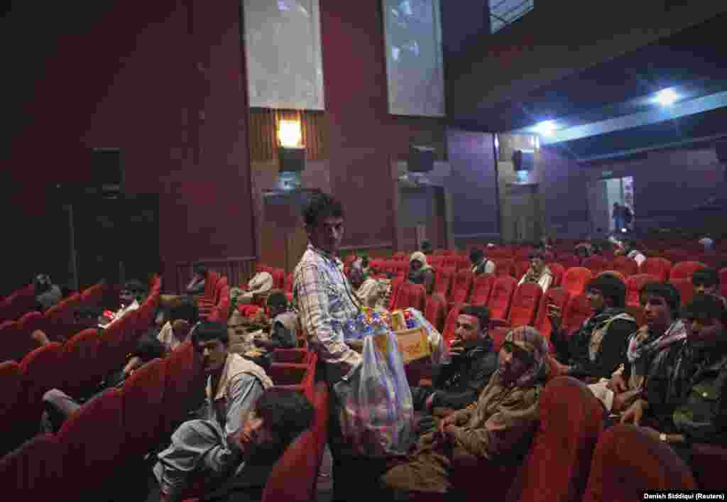 A cinema employee sells refreshments during an intermission on May 3, 2012.