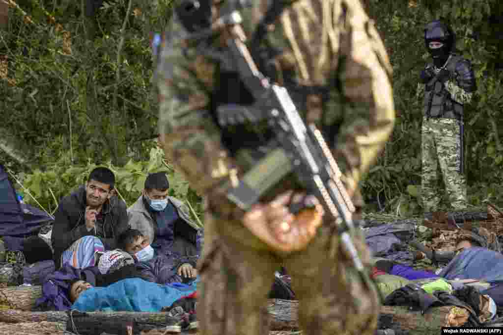 The stranded migrants photographed on August 20. &nbsp; Polish Deputy Foreign Minister Marcin Przydacz told reporters that the group near Usnarz Gorny&nbsp;&quot;are not refugees, they are economic migrants brought in by the Belarusian government.&rdquo; &nbsp;