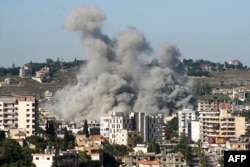 Smoke rises from the site of a string of Israeli air strikes that targeted the southern Lebanese city of Nabatieh on June 20.