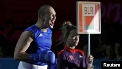 Siarhei Karneyeu of Belarus walks to the ring for his fight against Julio Castillo Torres of Ecuador fight during their Men's Heavy (91kg) Round of 16 boxing match at the London 2012 Olympic Games.