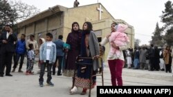 FILE: A Pakistani Christian survivor of an attack on a church leaves after attending Christmas Day mass in Quetta on December 25, 2017. 