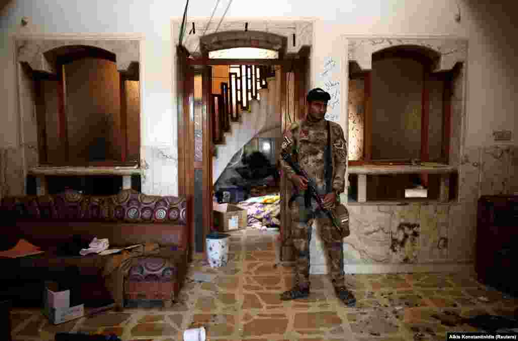 An Iraqi soldier inside the compound. The battle to liberate Mosul, now in its eighth month, has been slower than expected, in part because of the militants' tactic of fighting amid civilian areas. 