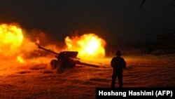 AFGHANISTAN -- An Afghan National Army soldier fires an artillery shell during an ongoing anti-Taliban operation in Farah province, January 28, 2018