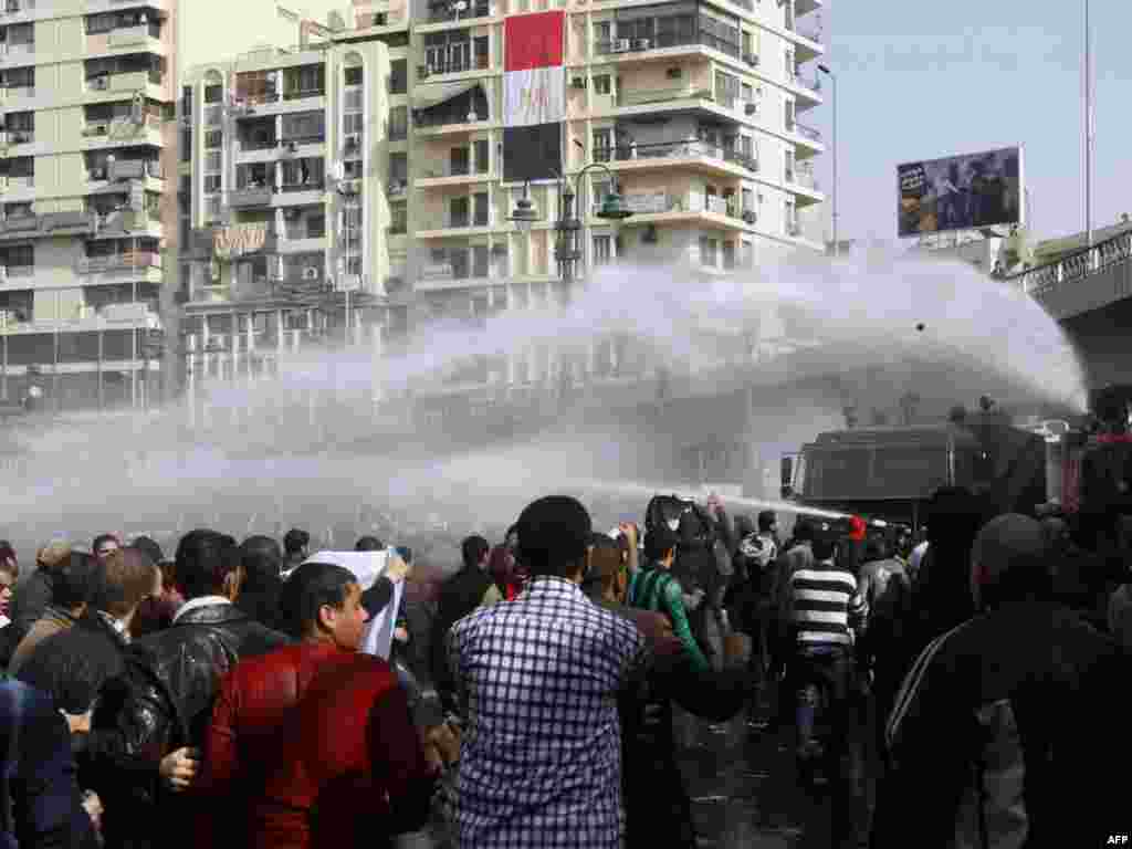 Antigovernment protesters confront riot police in Cairo on January 28.