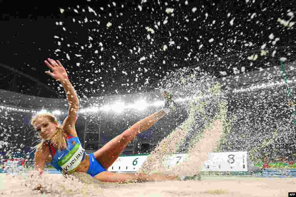 Russia&#39;s Darya Klishina competes in the women&#39;s long-jump final.