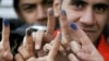 Iran-voters show their colorful fingers after voting in parliament election,undated