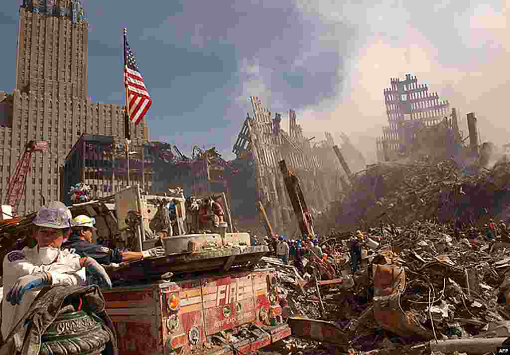 As it once was: Firefighters and rescue workers battle smoldering fires as they search for survivors at the ruins of the World Trade Center in New York on September 13, 2001.