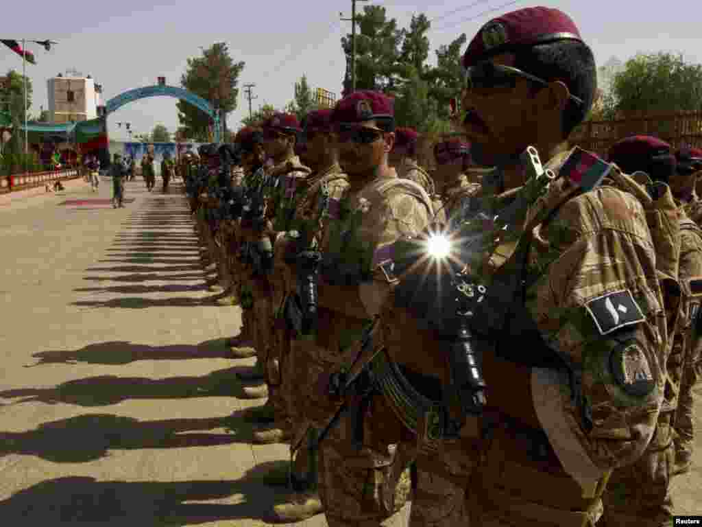 Afghan soldiers line up during a ceremony to take over control of security from NATO forces in the town of Lashkar Gah in Helmand Province, southern Afghanistan on July 20.Photo for Reuters by Shamil Zhumatov