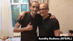 Fuad Ahmadli (left) celebrating his release