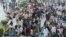 Supporters of the banned Islamist political party Tehrik-e Labaik Pakistan (TLP) protest in Lahore on October 23 demanding the release of their leader and the expulsion of the French ambassador over cartoons depicting the Prophet Muhammed.