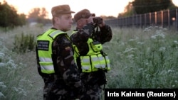 Lithuanian border guards use thermovision devices to control Lithuania-Belarus border near Adutiskis on June 15. 