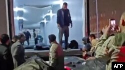 This video grab, taken on January 15 from UGC images posted on social media the previous day, shows bodies lying on the stretchers outside a medical facility in Tehran following widespread anti-government protests.