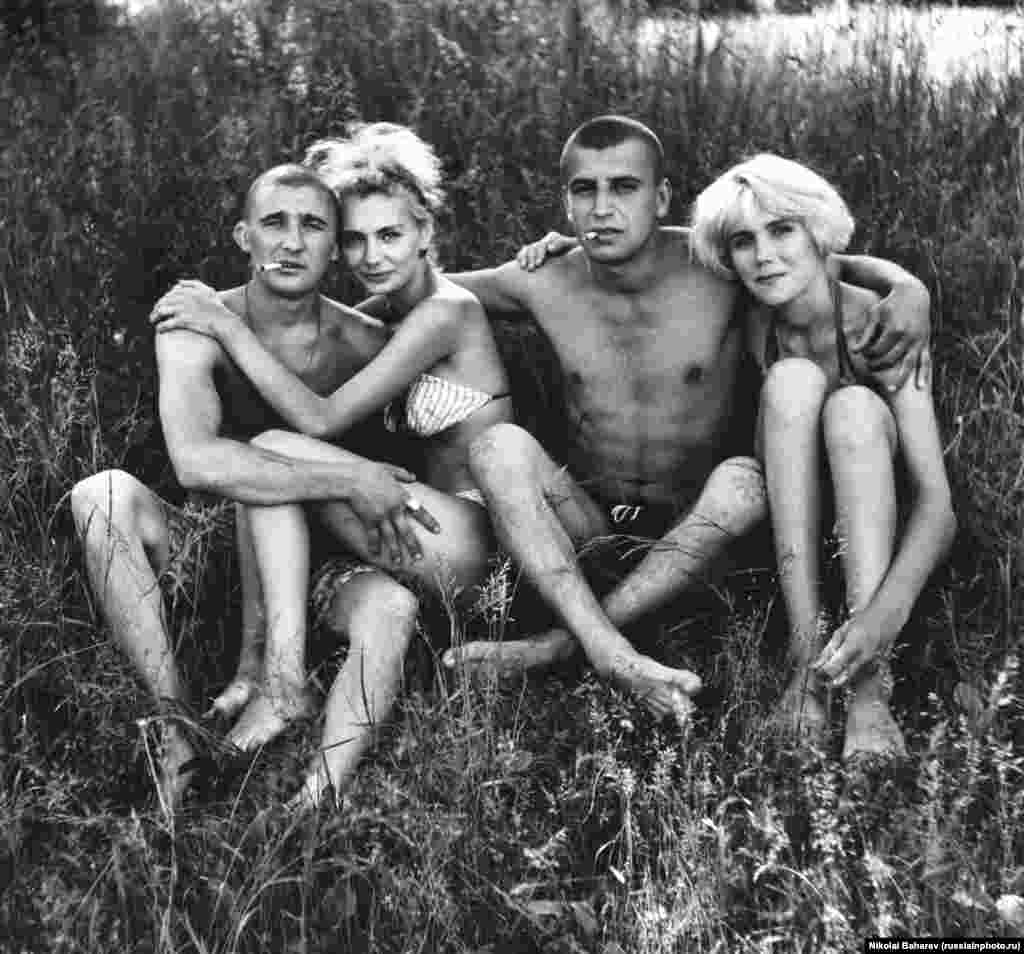 Young Russians relaxing in the sun. The photographer, Nikolai Baharev, grew up an orphan and worked as a locksmith, photographing people in his spare time. Today the 69-year-old exhibits in Europe&#39;s most prestigious galleries.&nbsp;