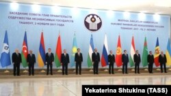 CIS representatives pose during a meeting in Tashkent on November 3.