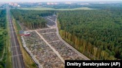 Fresh graves are seen at the Butovskoye cemetery outside Moscow, which serves as one of the burial grounds for those who died of COVID-19.