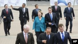 G8 leaders walk to the first working session at the G8 summit in Deauville, France, on May 26, the first of two days at the gathering.