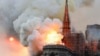 Smoke and flames rise during a fire at the landmark Notre-Dame Cathedral in central Paris on April 15, 2019, potentially involving renovation works being carried out at the site, the fire service said.