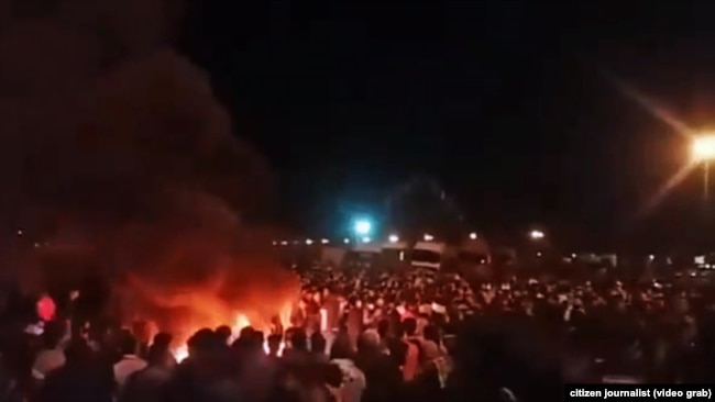 A video grab shows protests in the city of Sirjan in southern Iran against the increase in gasoline prices.