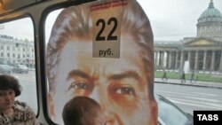 Stalin blocks a passenger's view of downtown St. Petersburg.