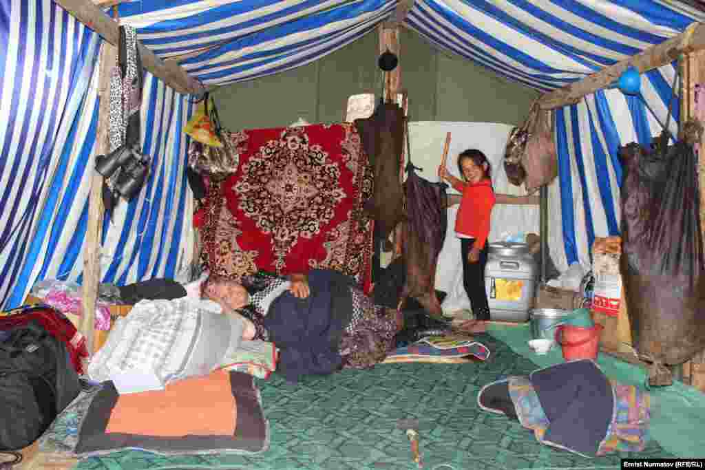 A small tent, less sturdy than a yurt, is set up to serve as a kumis bar for tourists.