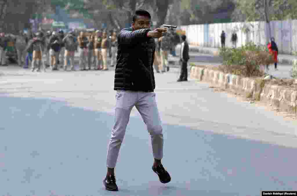 A man brandishes a gun in New Delhi on January 30, 2020, during a violent protest against a new citizenship law.