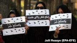 FILE: An Afghan women protest in Herat in March demanded a seat at the peace negotiations.