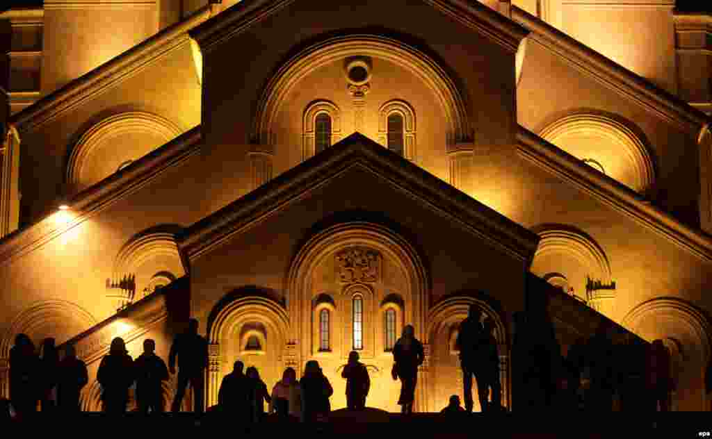 Georgian Orthodox believers gather at the Trinity Cathedral during a Christmas Mass in Tbilisi on January 7. (epa/Zurab Kurtsikidze)