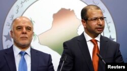 Yragyň premýer-ministri Haýdar al-Abadi (çepde) we parlamentiň spikeri, ýagny başlygy Salim al-Jabouri.