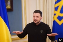 Ukrainian President Volodymyr Zelenskyy speaks to journalists during a press conference in Kyiv on February 26.