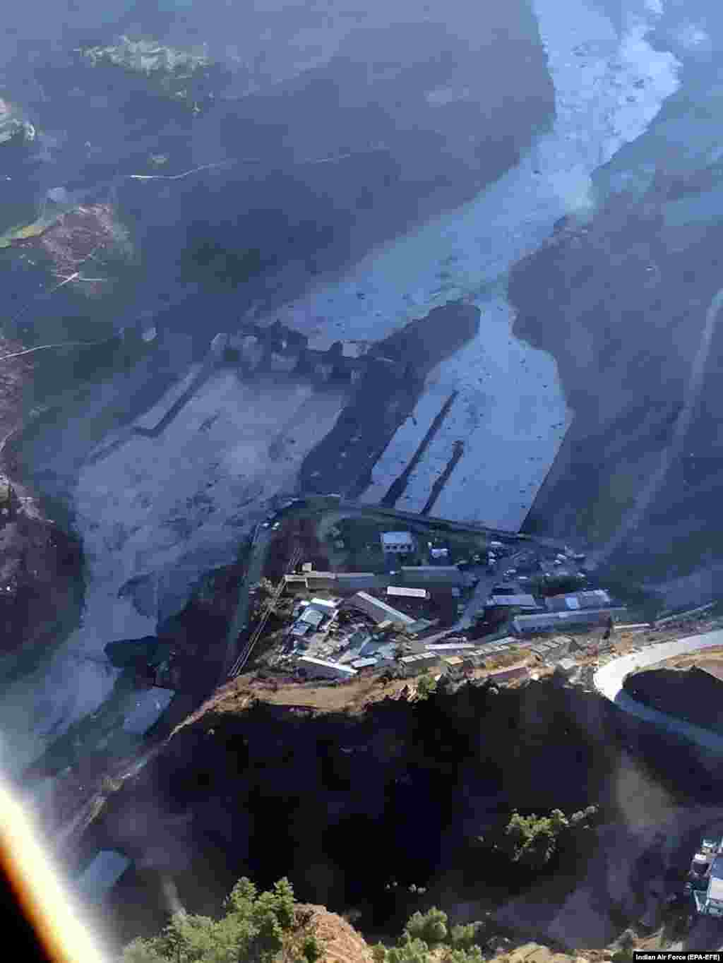 A handout photo made available by the Indian Air Force shows an aerial view of an area close to the Dhauliganga hydro power project at Reni village in Chamoli district, Uttarakhand on Monday, February 8, 2021. EPA-EFE/INDIAN AIR FORCE