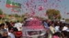 People welcome the convoy of cricket star turned politician Imran Khan on his way to a rally in Pakistan's tribal areas. His Tehreek-e Insaaf party is seen as somehting of a wild card in the country's upcoming parliamentary elections. 