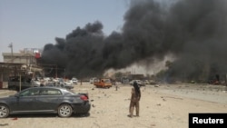 دخان متصاعد من موقع تفجير بسيارة مفخخة في طوز خورماتو