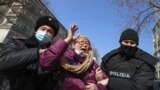 Kazakhstan. Police detain a woman during a rally. Almaty, February 28, 2021