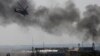 Ukraine -- A Ukrainian helicopter Mi-24 gunship fires its cannons against rebels at the main terminal building of Donetsk international airport May 26, 2014.