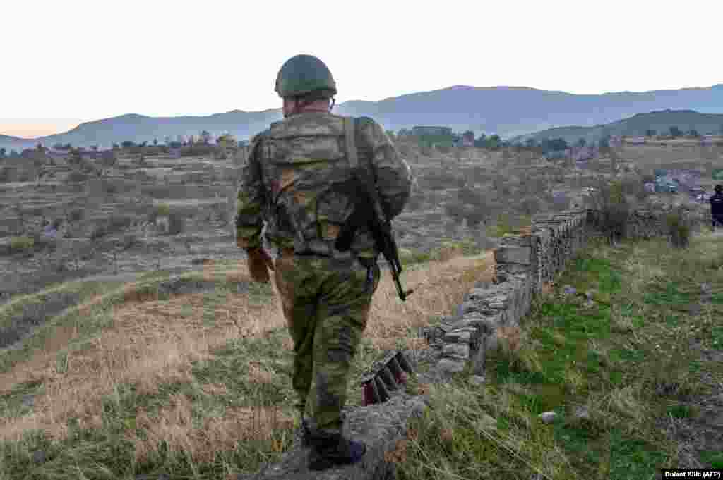 An Azerbaijani soldier stands in Jabrayil on October 16 after the town was captured from ethnic Armenian forces.