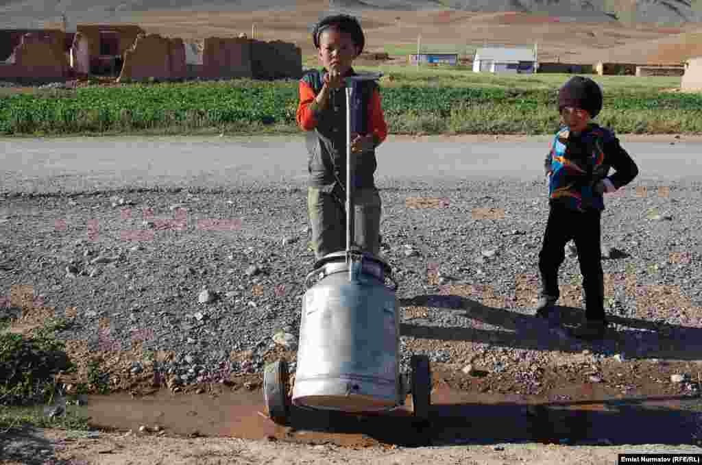 Kyrgyz children haul water in the village of Kara-Kabak.