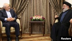 Lebanon's Hezbollah leader Sayyed Hassan Nasrallah (R) with Iranian Foreign Minister Mohammad Javad Zarif, November 8, 2016