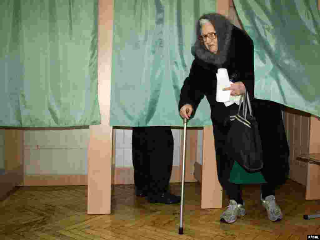 A pensioner casts her vote at a polling station in Kyiv.