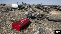 Debris is strewn in the desert at the site of the crash of Kogalymavia/Metrojet Flight 9268 on the Sinai Peninsula.