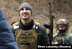 Wladimir Klitschko visits a checkpoint in Kyiv in March last year.