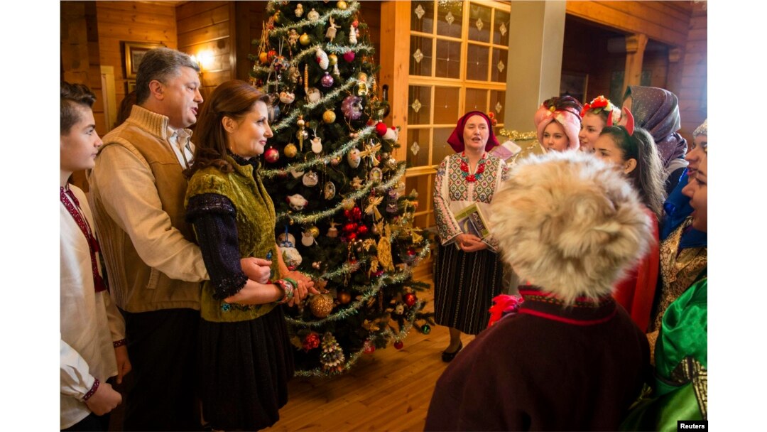 Ukrainian President Petro Poroshenko and his wife, Maryna, meet with Christmas singers in the Ivano-Frankivsk region of western Ukraine.