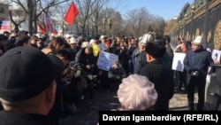 Activists rally in front of government headquarters in Bishkek on March 5 to demand reforms to the judicial system. 