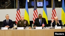 (Left to right) NATO Secretary-General Jens Stoltenberg, Chairman of the U.S. Joint Chiefs of Staff General Mark Milley, U.S. Defense Secretary Lloyd Austin, and Ukrainian Defense Minister Oleksiy Reznikov attend a NATO defense ministers meeting in Brussels on February 14.