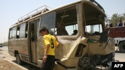 A bus that was hit by a roadside bomb attack in Baghdad's Sadr City district.