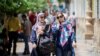 Iranian women walking in Ferdowsi street in Tehran, Iran, July 6, 2019. 