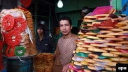 An man sells traditional sweets ahead of Afghan new year, Norouz, which was celebrated on March 21.